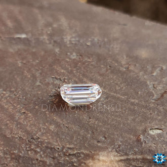 1.35 carat Moissanite offered in emerald cut style with clear faceting and brilliance.