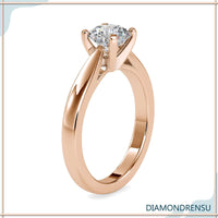Round diamond engagement ring with simple solitaire design in white gold