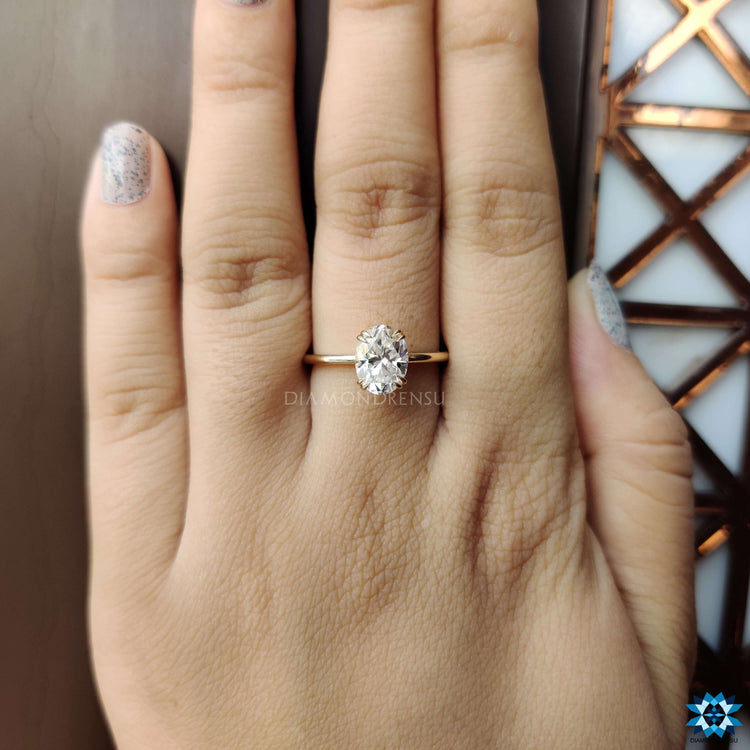 Oval cut engagement ring featuring a double claw prong setting
