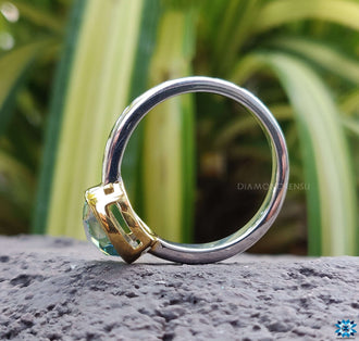 A dazzling white gold engagement ring adorned with a bezel set diamond, perfect for special occasions.