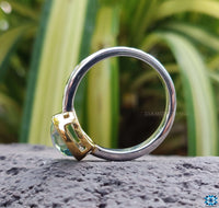 A dazzling white gold engagement ring adorned with a bezel set diamond, perfect for special occasions.