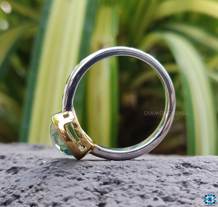 A dazzling white gold engagement ring adorned with a bezel set diamond, perfect for special occasions.