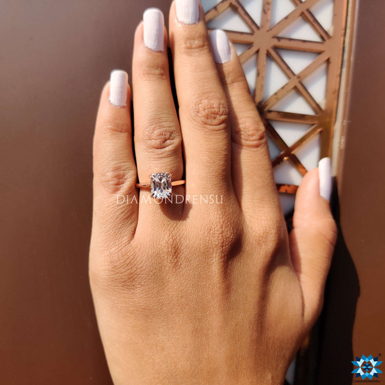 Solitaire engagement ring showcasing a cushion cut moissanite for timeless beauty.