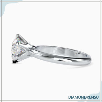 Round solitaire gold engagement ring with a radiant, classic design.