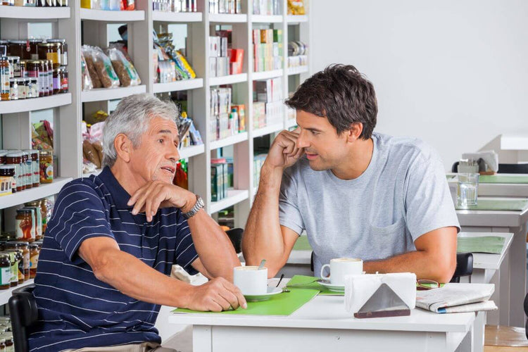 A man discussing his marriage proposal to his girlfriend's father.