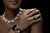 A lady wearing White Gold and Sterling Silver jewelry