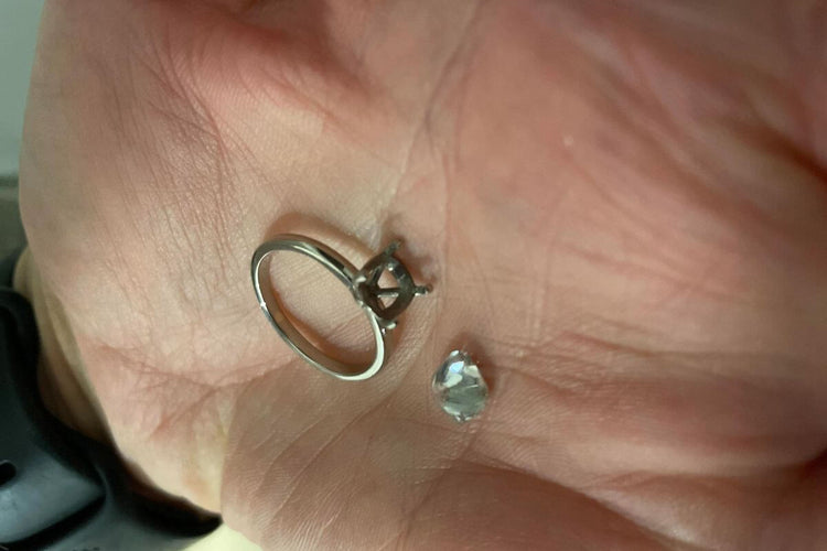 A diamond ring that has lost its diamond