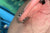 A girl wearing butterfly back earring close up view