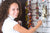 A lady showing how to store necklaces at home and avoid tangling