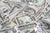 Various diamonds kept on money depicting their value 