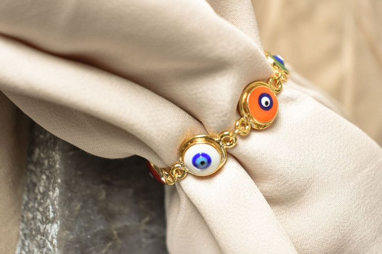 A beautiful gold evil eye bracelet.