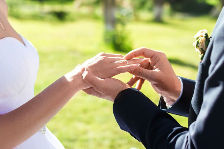 Lady wearing ring on right hand ring finger at her engagement ceremony