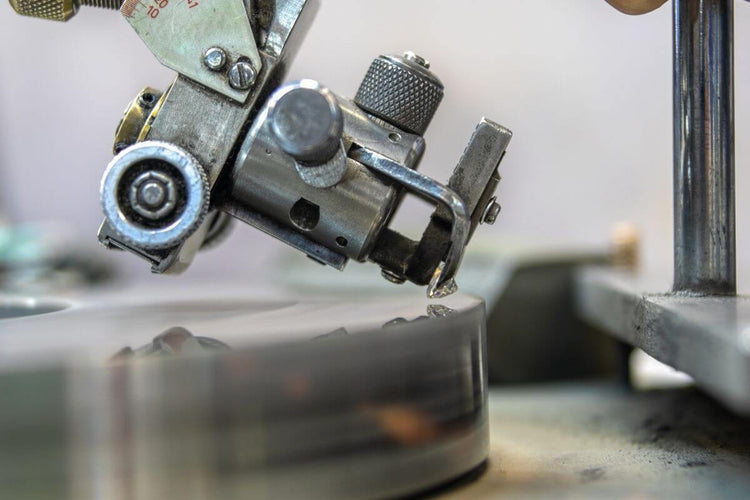 A close up view of diamond cutting process into a machinery