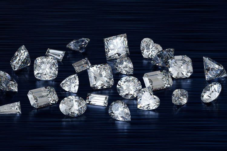Diamonds with various cuts on a table