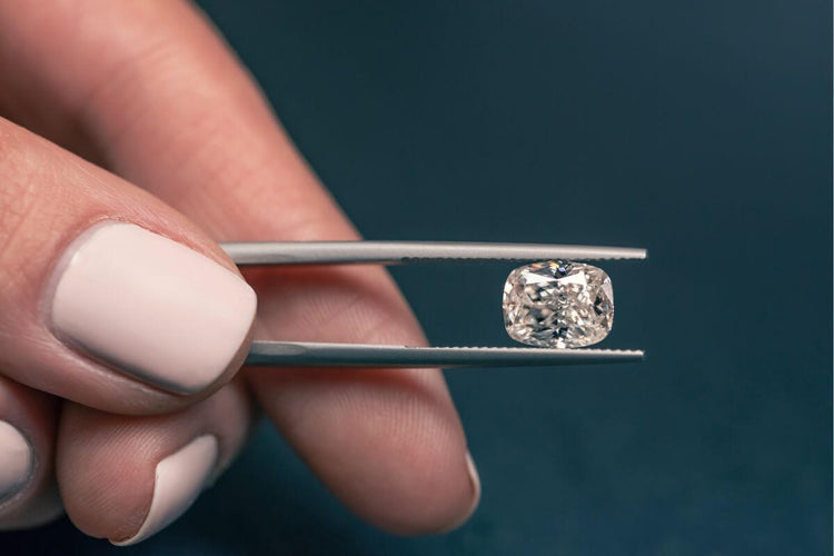 A lady showing man made diamond