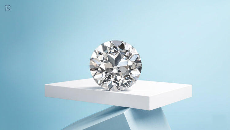 Polished Old European cut diamonds showcased on a white geometric pedestal with a clean light blue background.