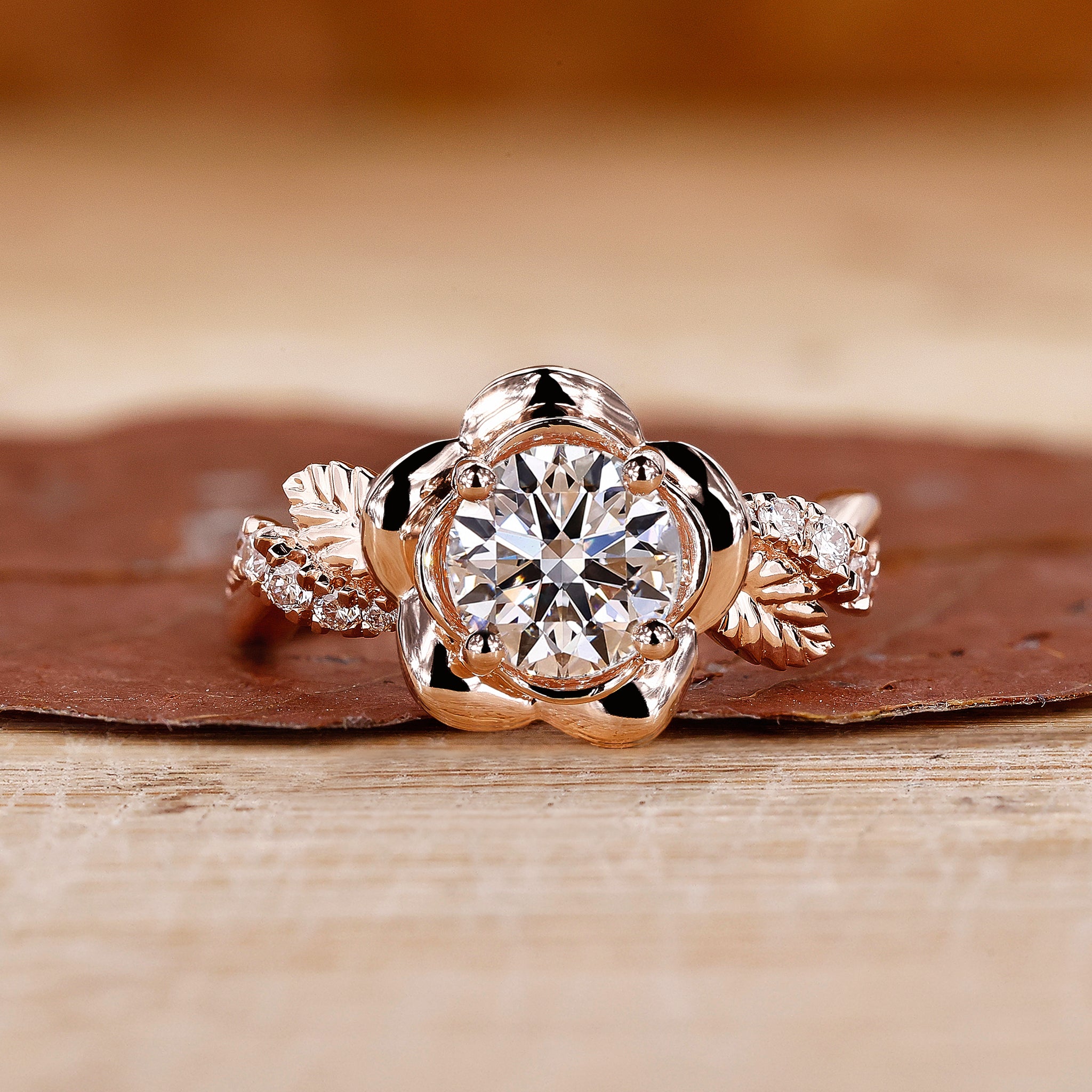 Round cut diamond ring with intricate floral design, showcasing a stunning round brilliant cut diamond and round prongs