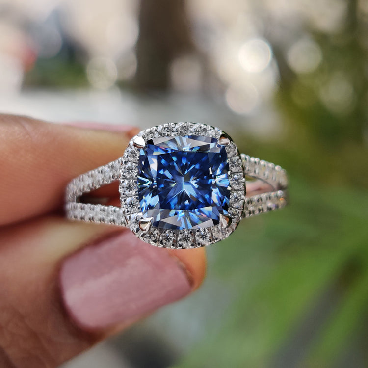 Cushion cut engagement ring with royal dark blue moissanite.

