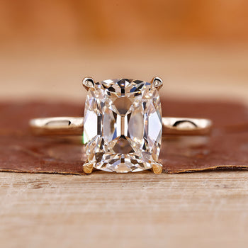 Old mine cushion cut diamond in claw prong setting.