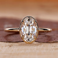 Simple diamond solitaire ring with oval old European cut diamond.
