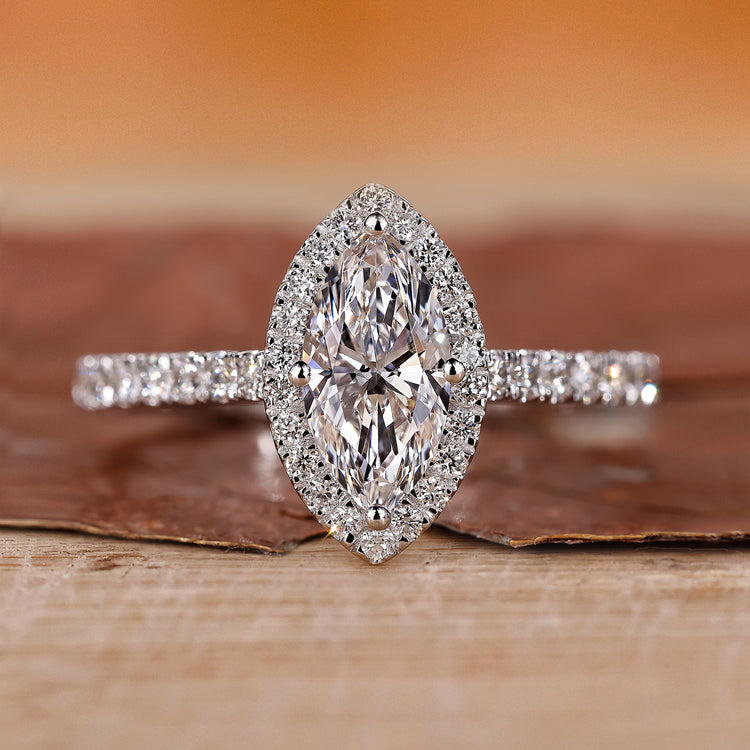 Marquise diamond ring with a diamond round cut shines brightly.
