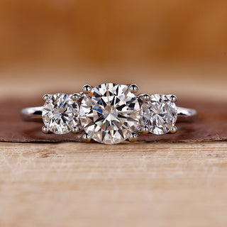 3 stone round diamond ring with timeless elegance.
