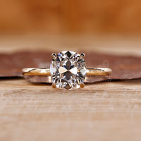 Yellow gold engagement ring with 4 prong setting.
