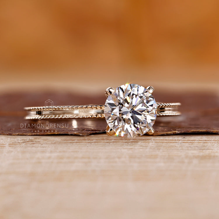 Four tab prong ring paired with round cut diamond ring for diamondrensu engagement ring.
