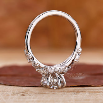 Handmade ring featuring a step cut oval diamond, highlighting its craftsmanship and nature inspired design.