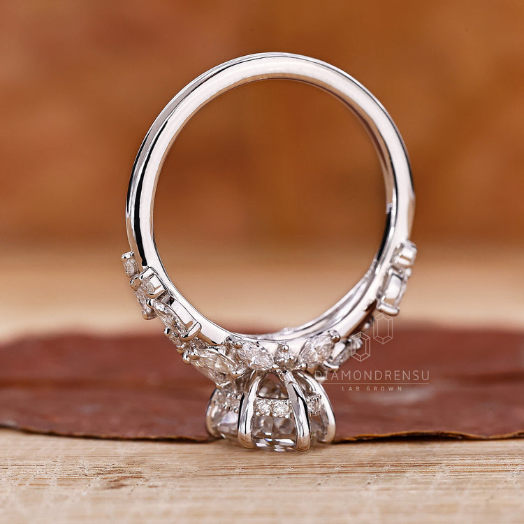 Handmade ring featuring a step cut oval diamond, highlighting its craftsmanship and nature inspired design.