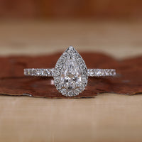 Pear Halo Engagement Ring with a stunning pave diamond band.
