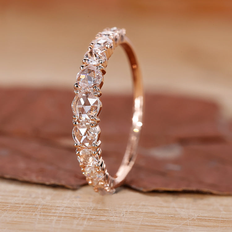 Shared Prong Wedding Band featuring brilliant round diamonds.