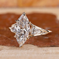 Marquise Diamond Ring with Pear Side Stones for added charm.