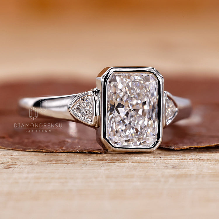 Radiant Cut Engagement Ring set in a sleek bezel setting.