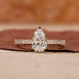 Pear shape diamond ring with a sparkling teardrop design and intricate details.
