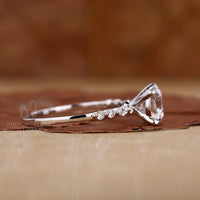 Dazzling round and marquise diamond ring with intricate details.
