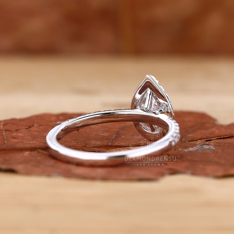 Lab grown diamond ring set in a sophisticated halo design.
