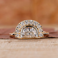 Half moon diamond ring with half halo engagement ring.
