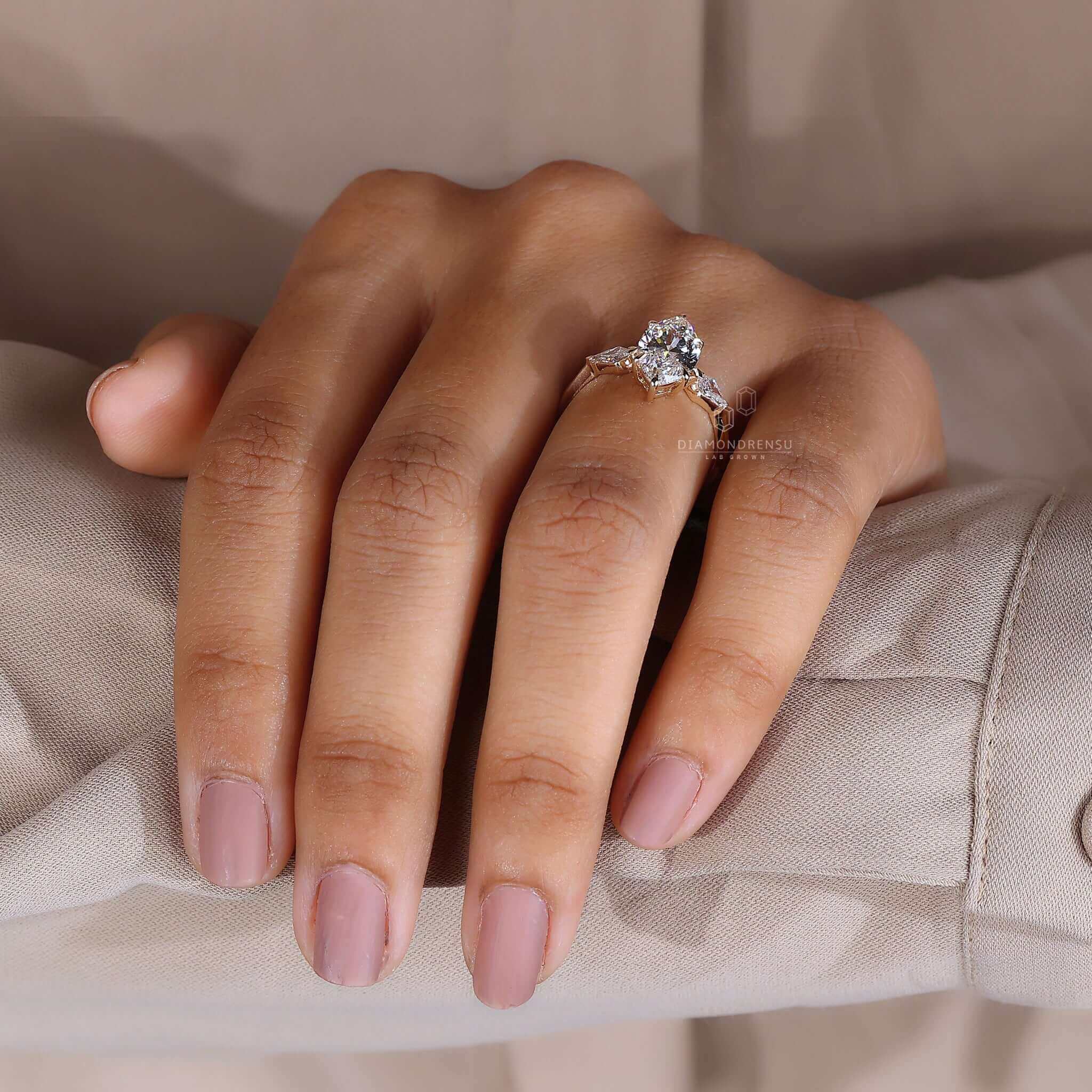 A woman's hand adorned with a unique and captivating diamond ring.