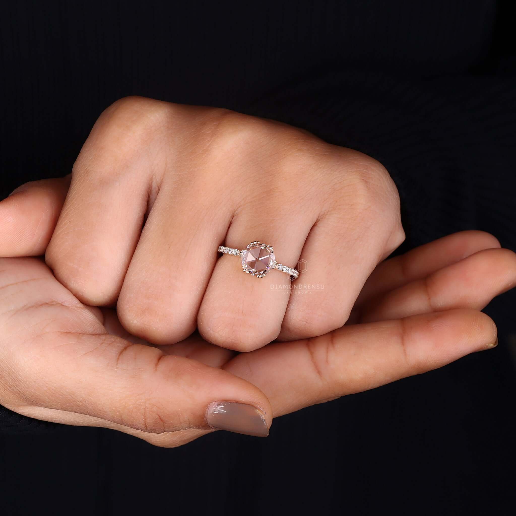 On-hand image of a lab-grown diamond engagement ring, a sustainable choice