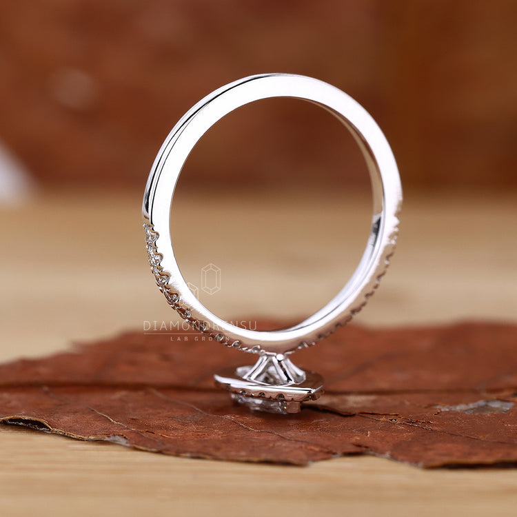 Handmade ring featuring a prong setting and lab-grown diamond.
