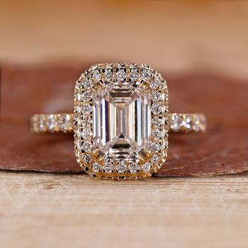 Emerald halo engagement ring with Two Side Halo.
