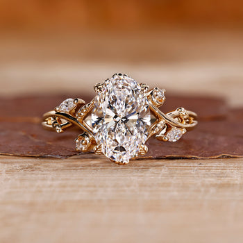 Nature inspired engagement ring with oval diamond.
