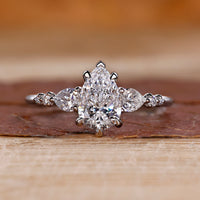 Pear diamond ring in white gold band.
