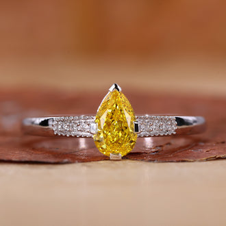 Pear Shaped Engagement Ring with a stunning yellow pear diamond.
