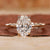 Hidden Halo Oval Engagement Ring with a stunning oval diamond.