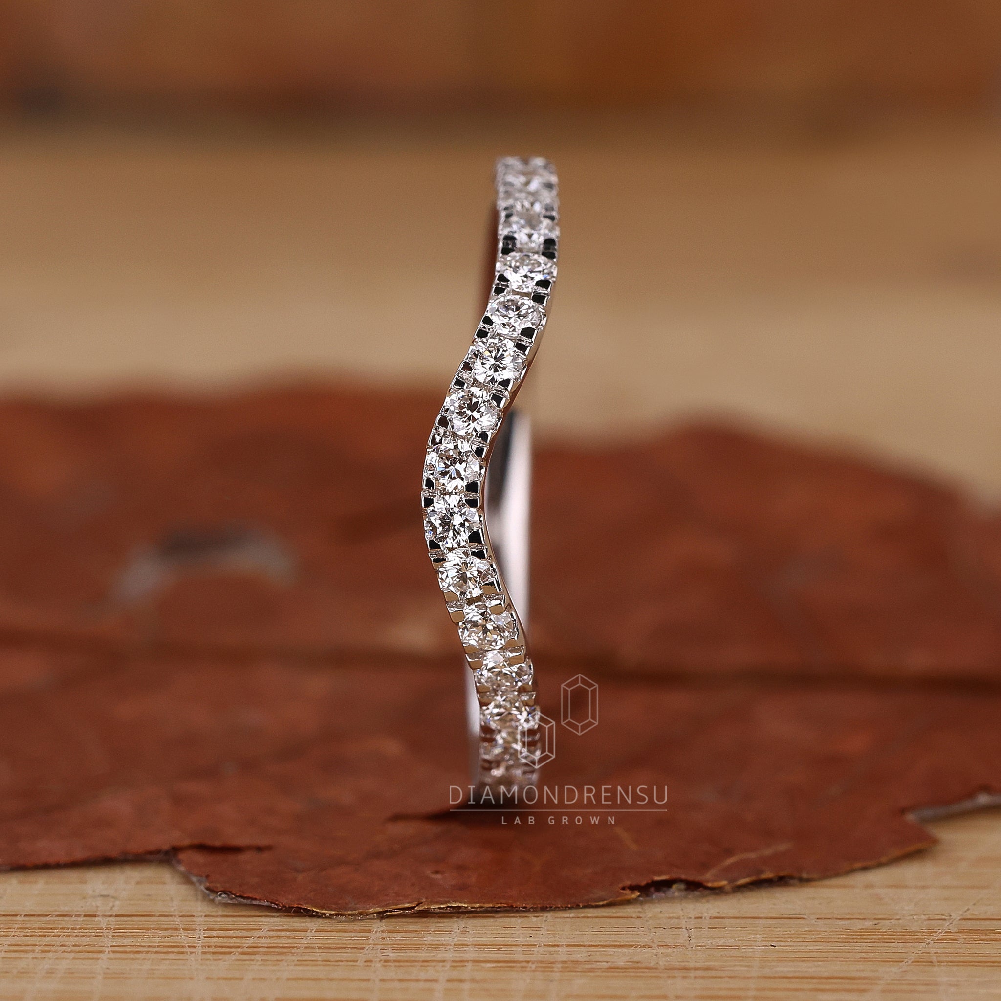 Half Eternity Wedding Band featuring diamonds around the band.
