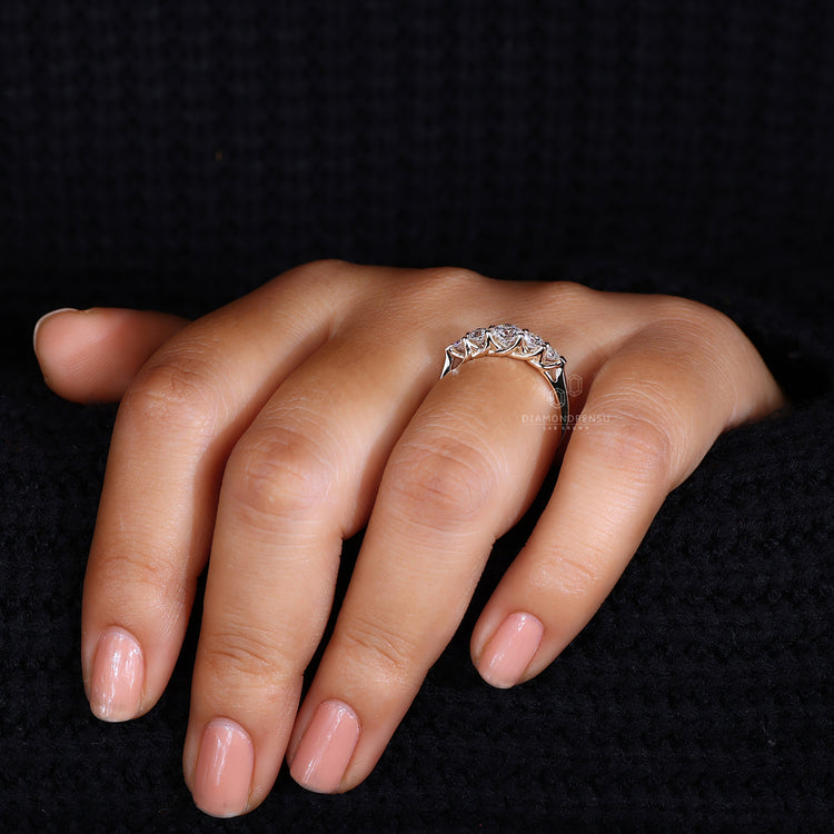 Elegant five stone wedding band in trellis setting.
