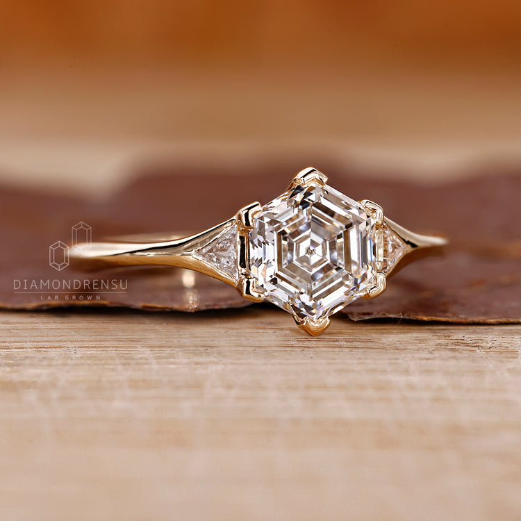 3 stone engagement ring with hexagon step cut center.
