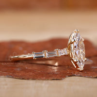 Baguette cut diamond with intricate pave setting on a gold band.
